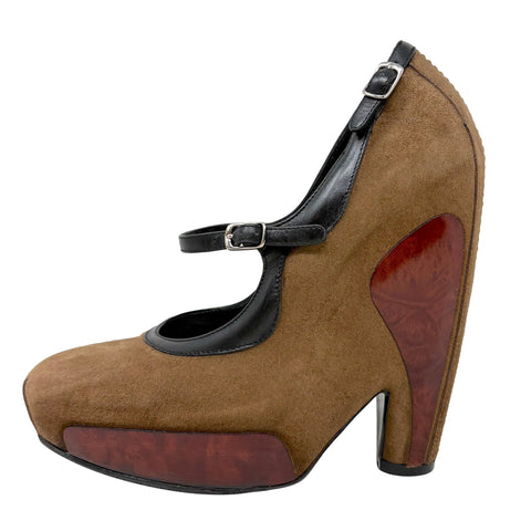 A brown suede Balenciaga Mary Jane high heel shoe with black leather trim, a block heel, and a glossy reddish-brown wood-textured accent on the heel and platform.