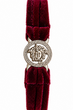 A Versace bracelet featuring deep burgundy velvet straps and a silver-tone Medusa medallion clasp, shown against a plain white background.