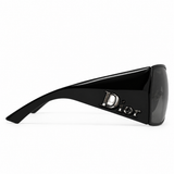 Dior sunglasses with a glossy black acetate frame and dark gray lenses, featuring the Dior logo on the temple arm, shown against a plain white background.