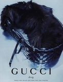 Gucci dog print poster featuring a black dog curled up inside a black woven basket, with the word 'GUCCI' and 'dog' printed at the bottom on a light background.