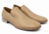 A pair of Margiela men's slip-on loafers in light tan leather, shown from a three-quarters angle on a plain white background.