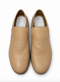 A pair of tan MARGIELA leather slip-on shoes photographed from directly above on a clean white background.
