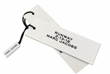 A pair of white Marc Jacobs Runway event tags with black printed text, attached to a black string with a small branded tag on a white background.