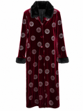 A long burgundy velvet robe with a black faux-fur collar and cuffs, featuring an allover circular Versace medallion pattern, shown against a plain white background.