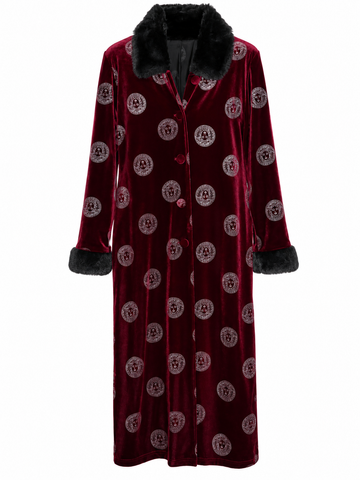 A long burgundy velvet robe with a black faux-fur collar and cuffs, featuring an allover circular Versace medallion pattern, shown against a plain white background.