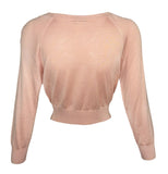 A pale Chanel pink long-sleeve knit crop top with a wide boat neckline, displayed on a clean white background.