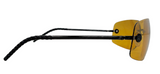 Side view of shield-style sunglasses with a black frame and a translucent yellow-tinted lens, shown on a plain white background.