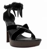 A black YSL platform high-heel sandal featuring a chunky block heel, criss-cross strap design, a fuzzy ankle strap, shown against a plain white background.